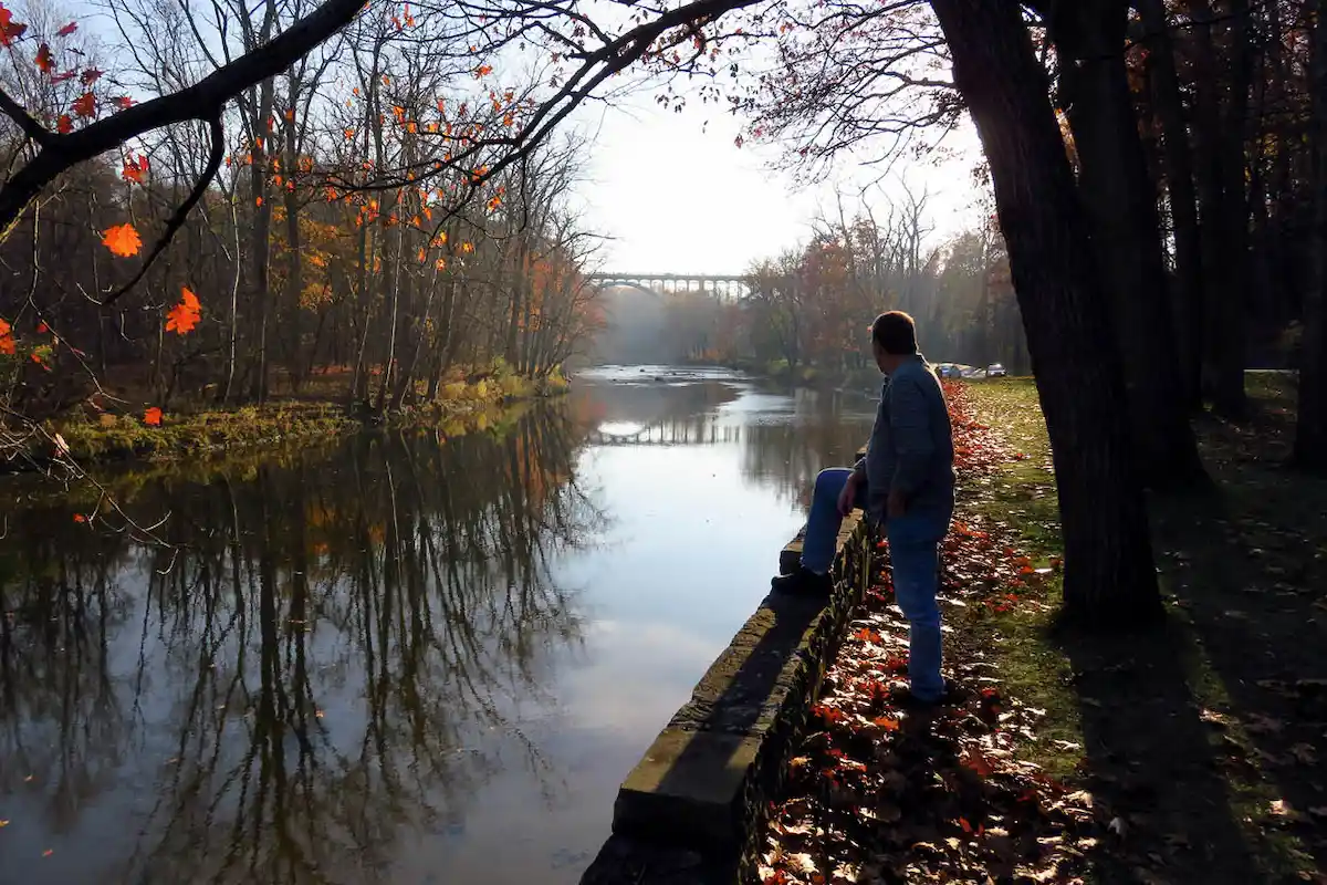 man overlooking the river at Rocky River Reservation of the Cleveland Metroparks